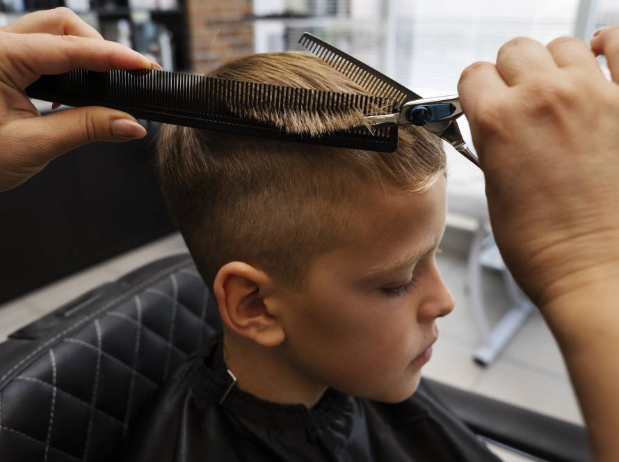 kid getting haircut salon high angle