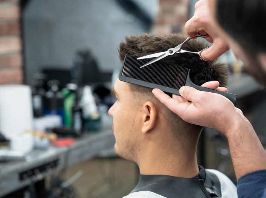 man getting haircut close up
